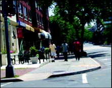 Tree-lined streets, shops with outdoor seating, and wide sidewalks are among the features that contribute to mixed-use development.