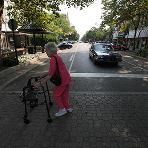 Elderly Lady Crossing the Street with a Walker