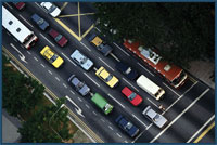 Aerial photo of traffic stopped at an intersection.